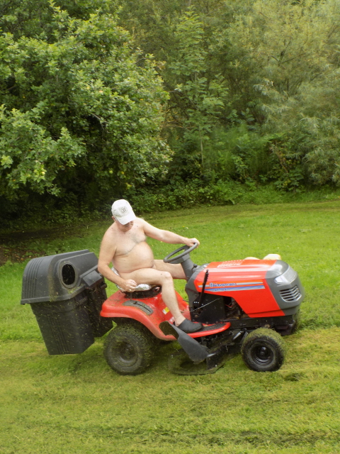 Naked Man Mowing The Lawn
